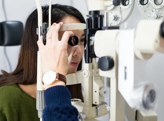 Women in eye clinic getting eye measured